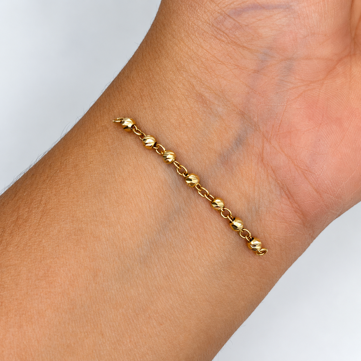 HERRAJE RETAZO BOLA DIAMANTADA ORO AMARILLO 18K 0,61 GR / 4,8 CM