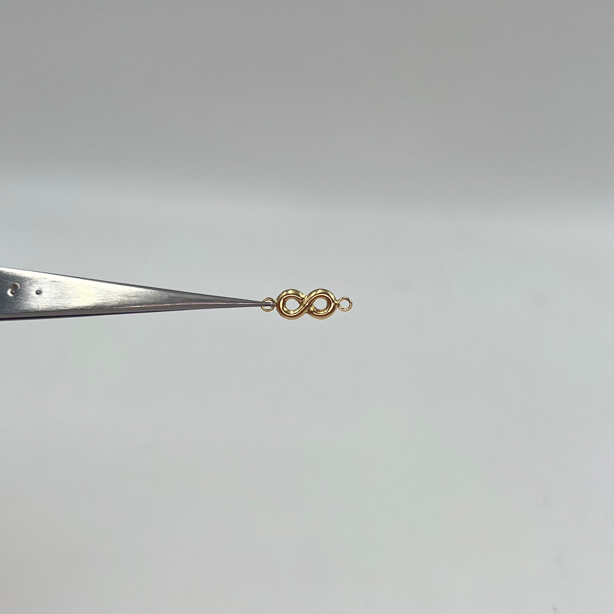 HERRAJE INFINITO ORO AMARILLO 18K +1 / 0,25 GR / 1,4 CM