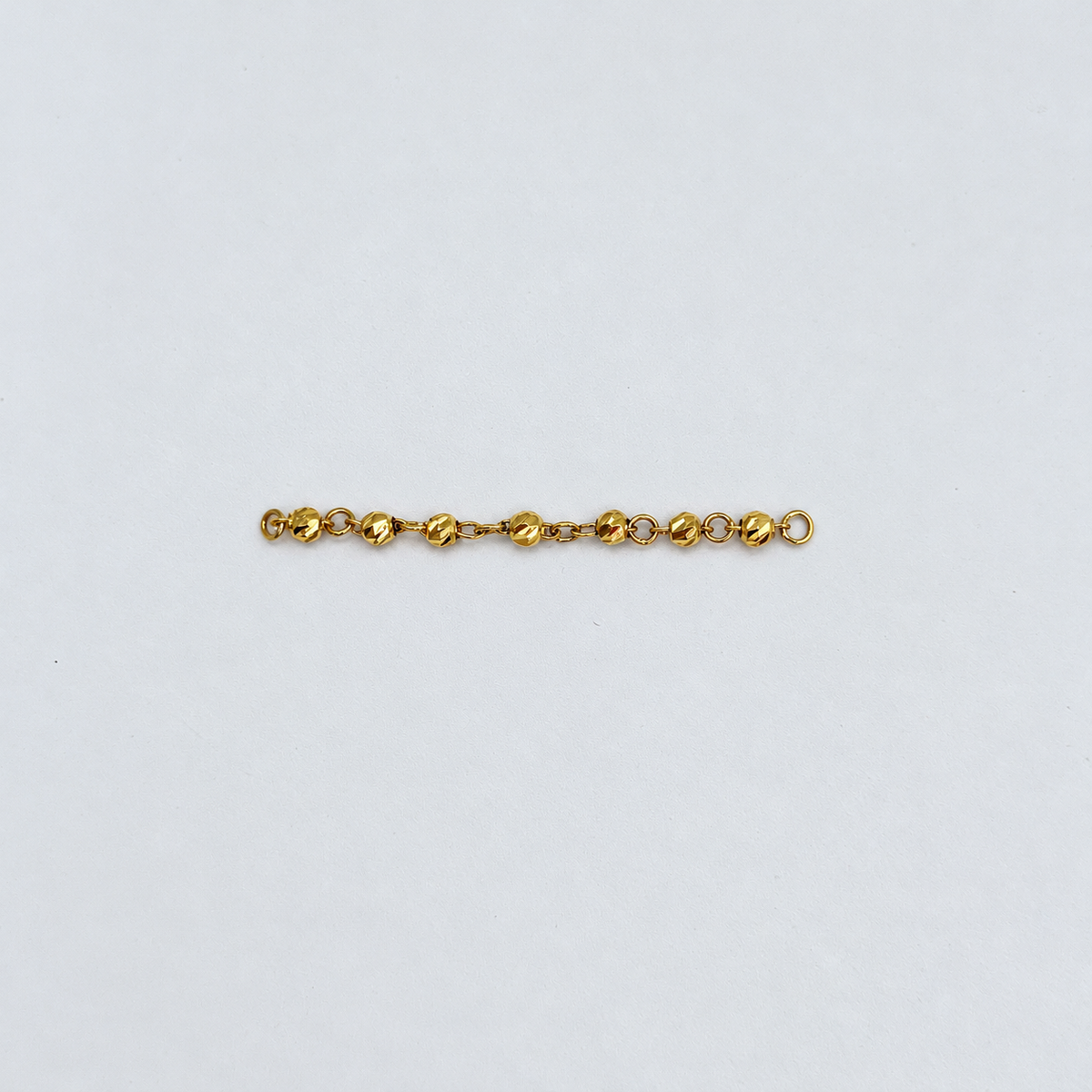 HERRAJE RETAZO BOLA DIAMANTADA ORO AMARILLO 18K 0,61 GR / 4,8 CM