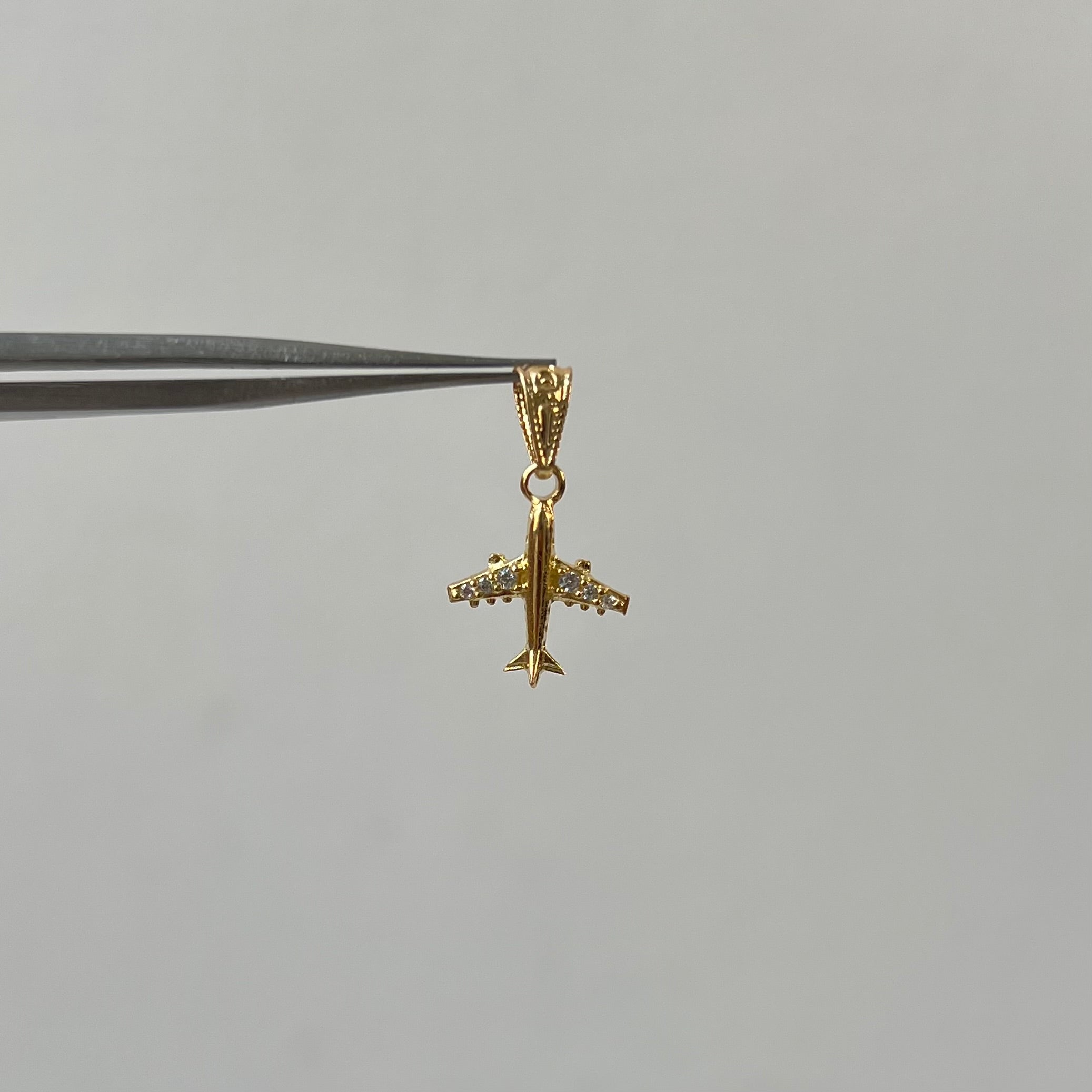DIJE AVION CON CIRCON BLANCO  ORO AMARILLO 18K 0,57 GR / 10 MM / 1,3 CM