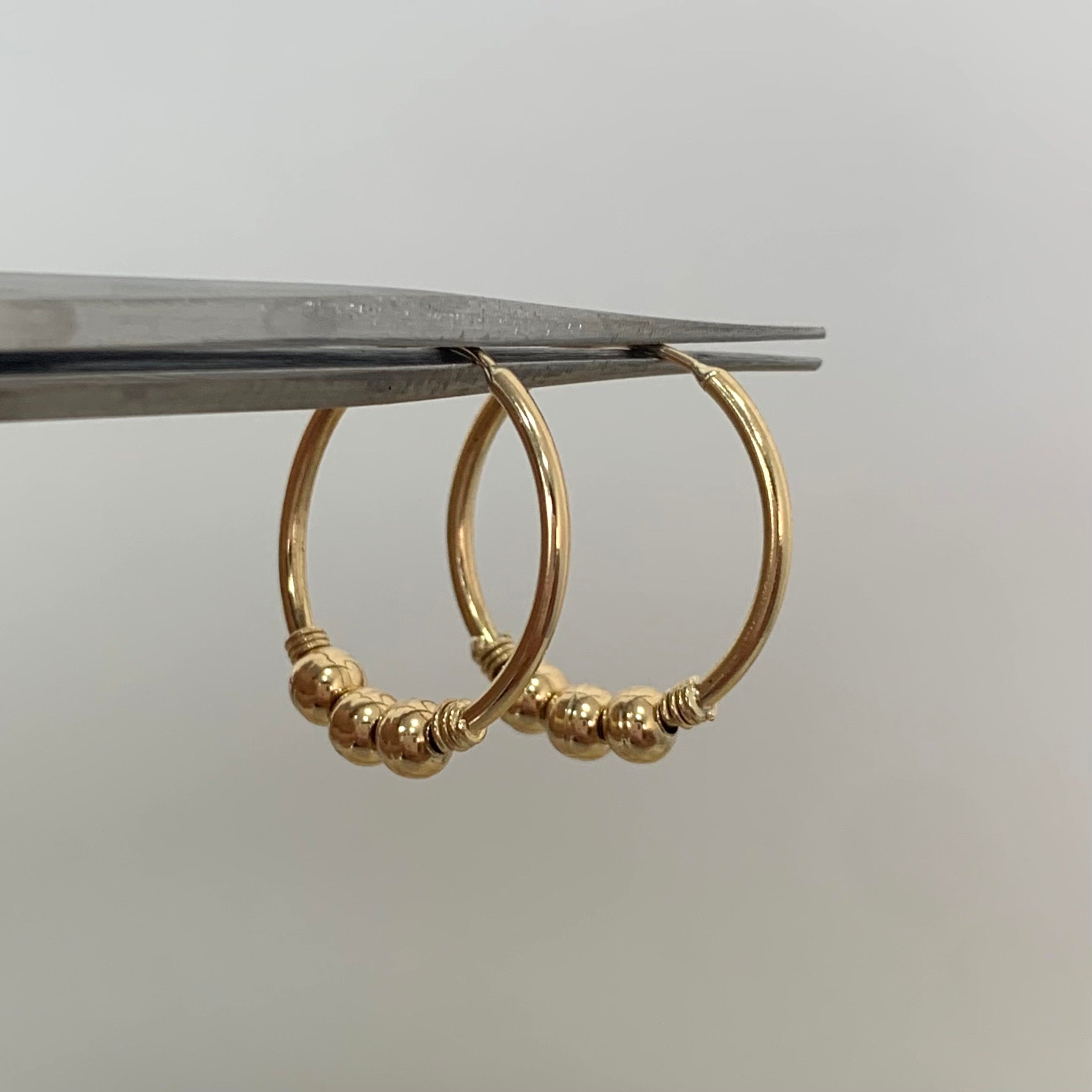 CANDONGA IMPERDIBLES BOLAS ORO AMARILLO 18K 1,22 GR / 1,6 CM