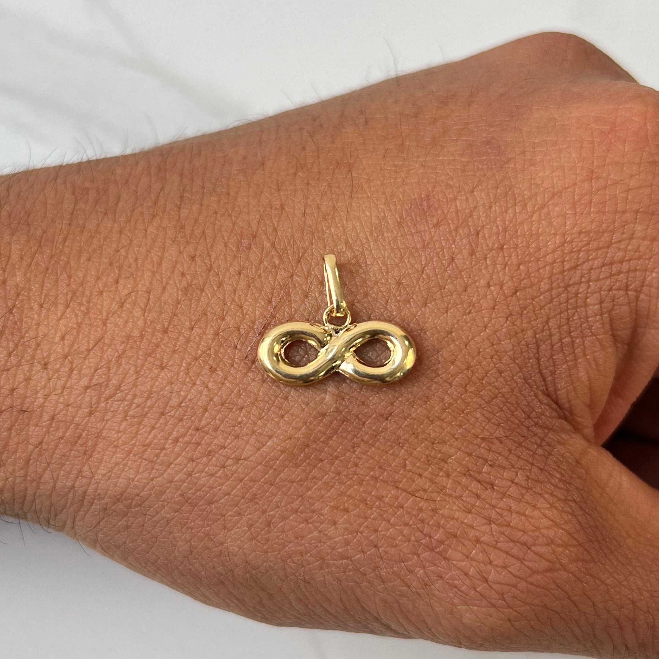 DIJE INFINITO  ORO AMARILLO 18K 0,73 GR / 9 MM / 1,6 CM