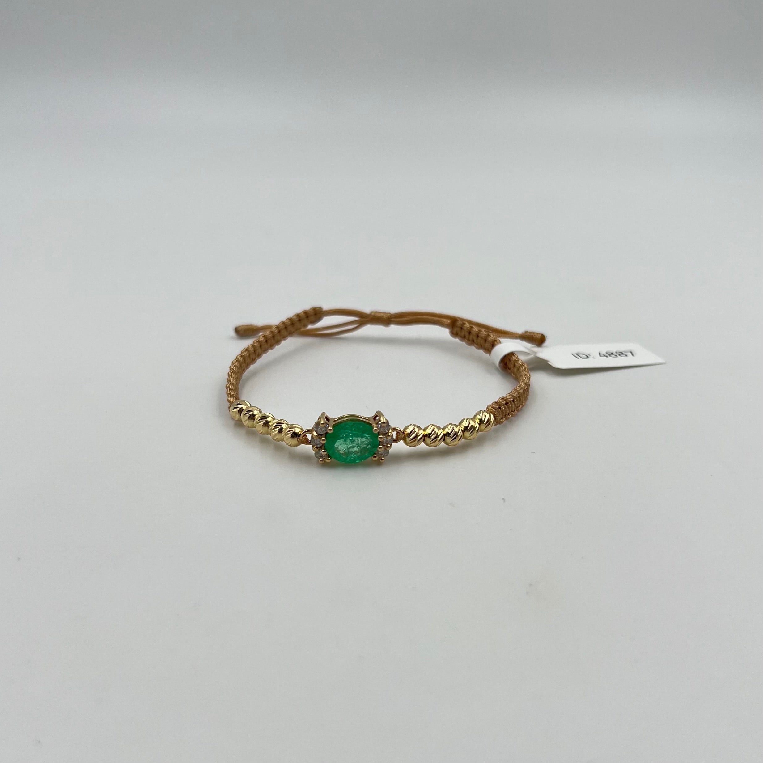 PULSERA TEJIDA DORADA / HERRAJE ESMERALDA 2,3 CT Y DIAMANTE 0,36 CT/ BOLA DIAMANTADA 4MM  / 1,02 GR (JOYA)