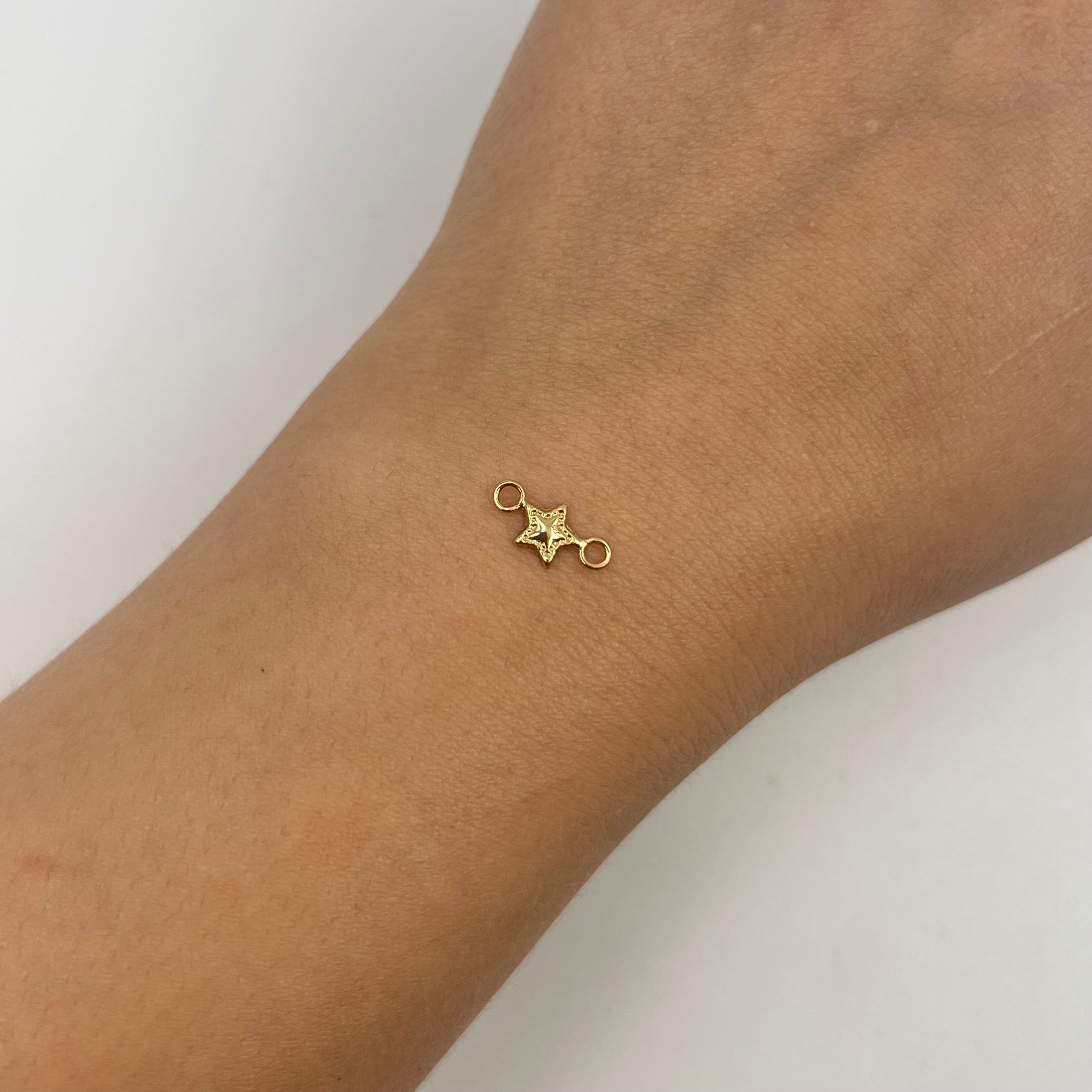 HERRAJE ESTRELLA ORO AMARILLO 18K 0,15 GR / 1,1 CM