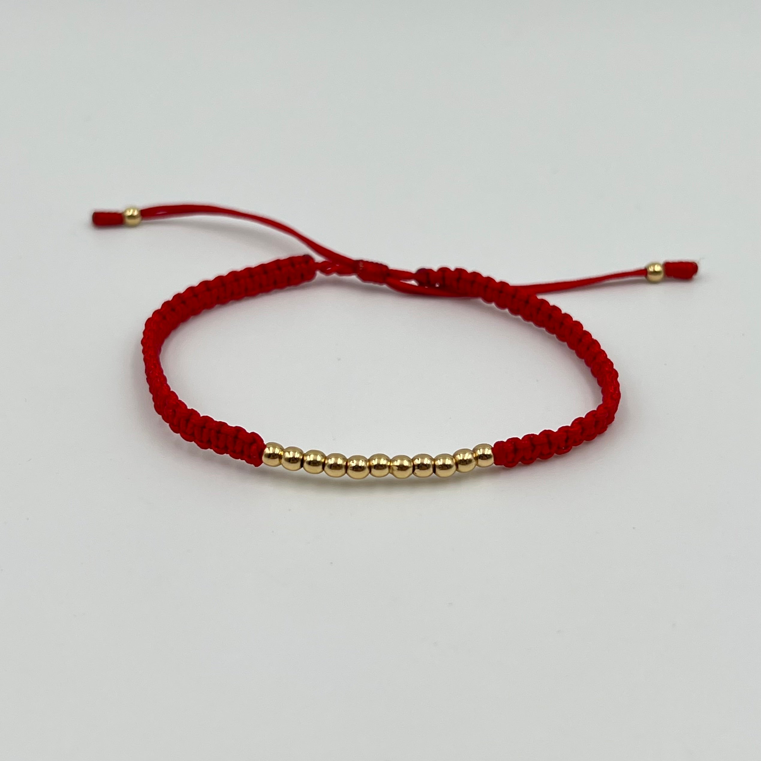 PULSERA TEJIDA ROJA / BOLA LISA 3MM