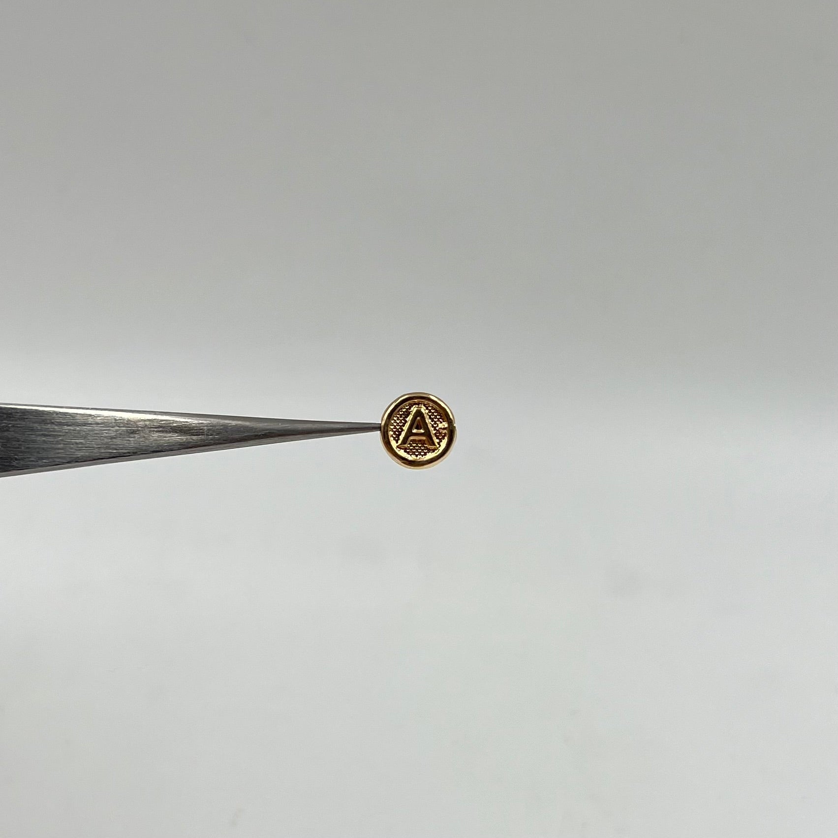 HERRAJE LETRA A TAMBOR ORO AMARILLO 18K 0,28 GR / 0,8 CM