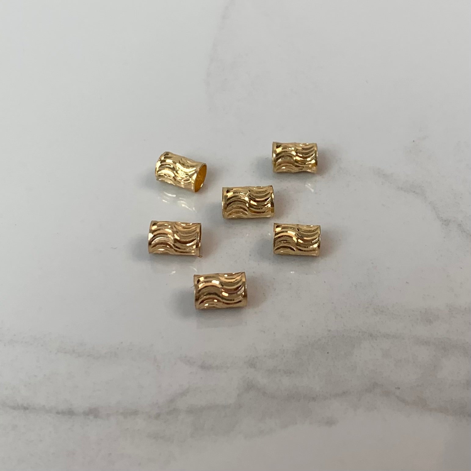 HERRAJE CILINDRO DIAMANTADO  ORO AMARILLO 18K 0,10 GR / 0,6 CM