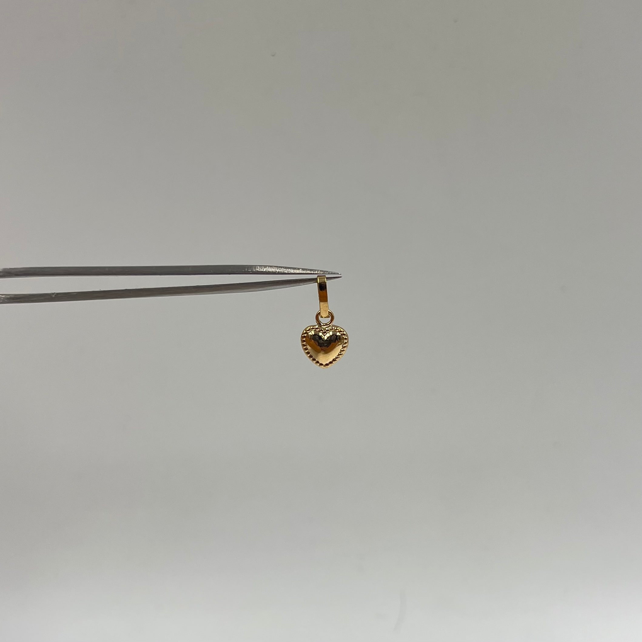 DIJE CORAZON BORDEADO  ORO AMARILLO 18K 0,36 GR / 8 MM / 1 CM