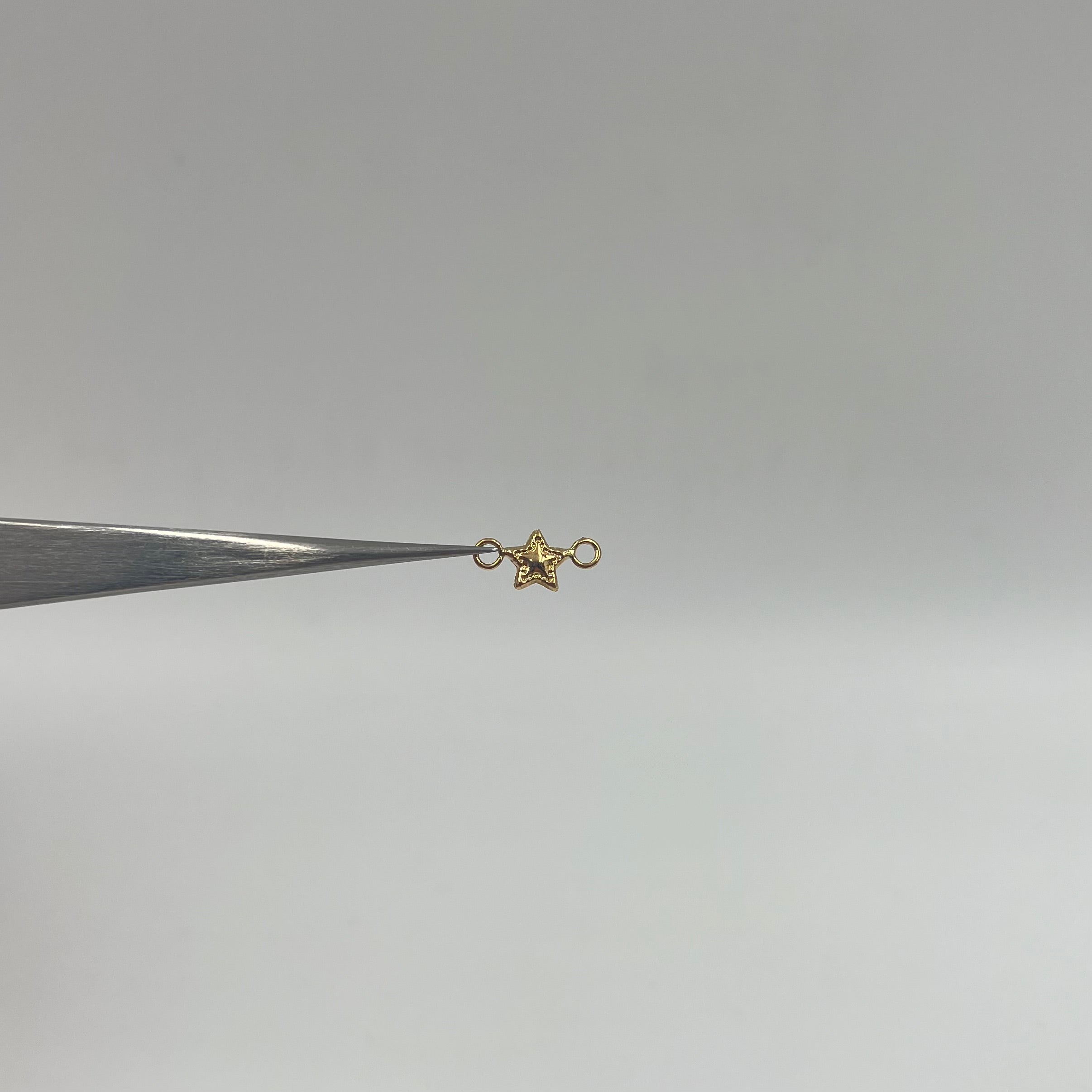 HERRAJE ESTRELLA ORO AMARILLO 18K 0,15 GR / 1,1 CM