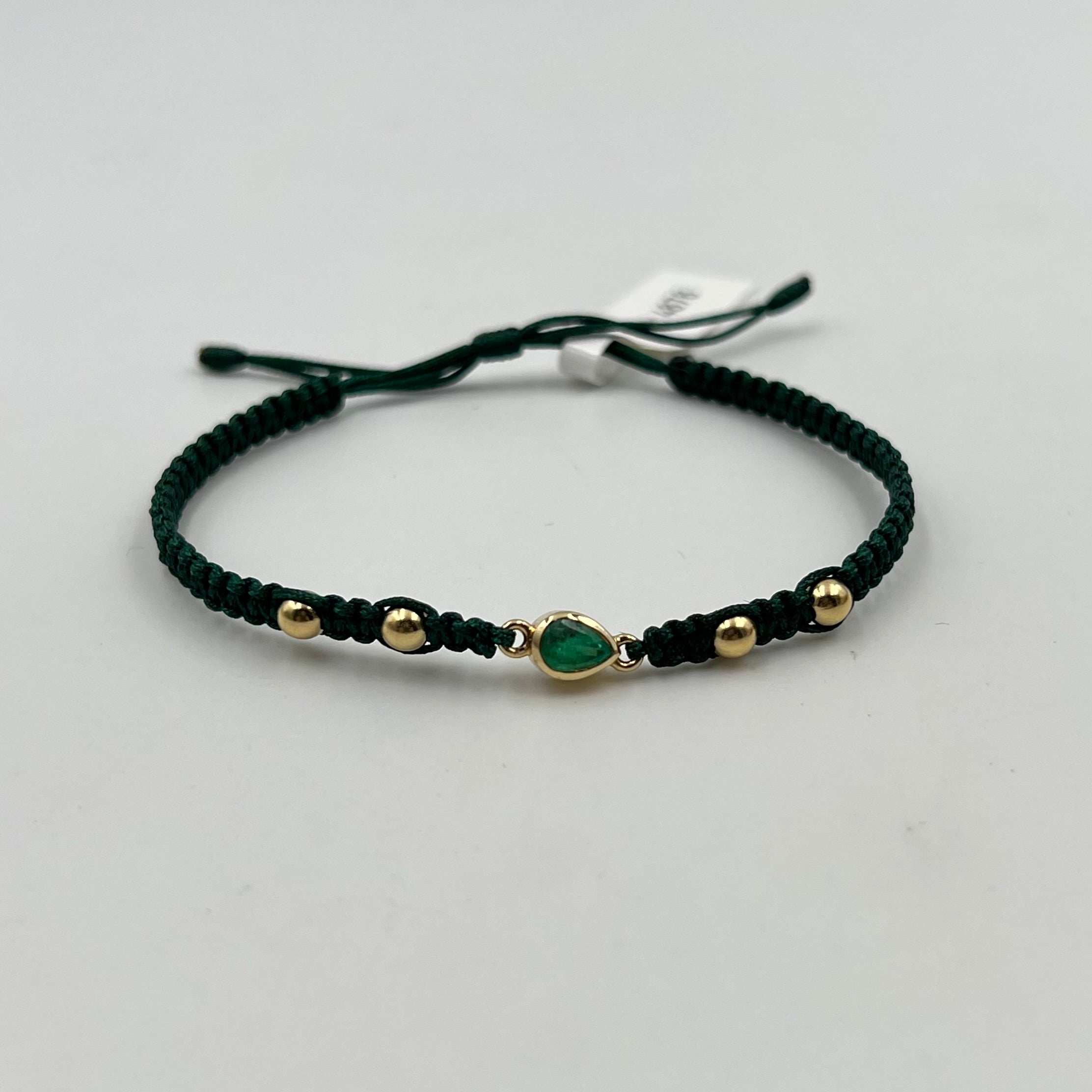 PULSERA TEJIDA VERDE / HERRAJE ESMERALDA 0,60 CT/  BOLA LISA 4MM / 1,23 GR (JOYA)