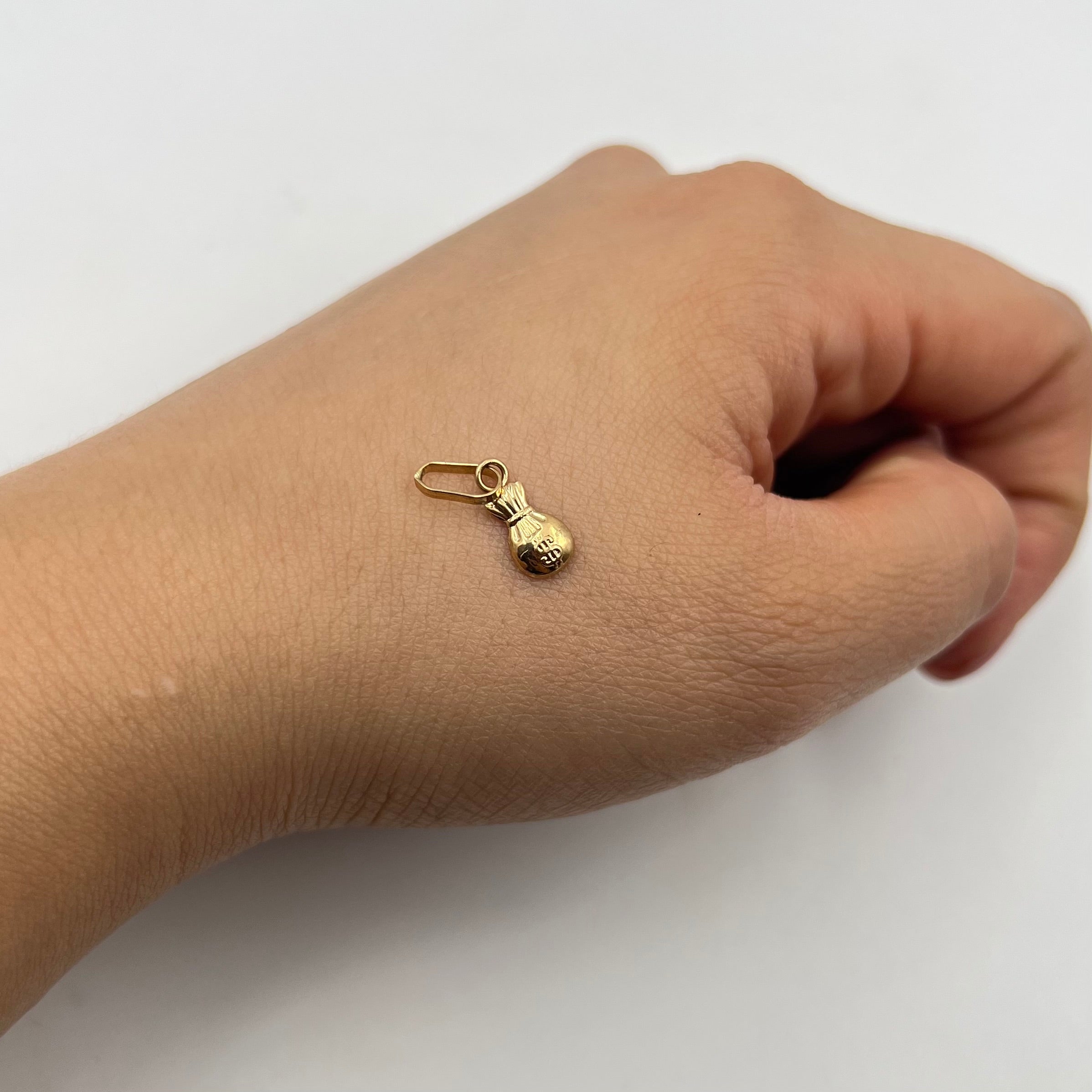 DIJE BOLSA DE DINERO  ORO AMARILLO 18K 0,29 GR / 5 MM / 1,1 CM