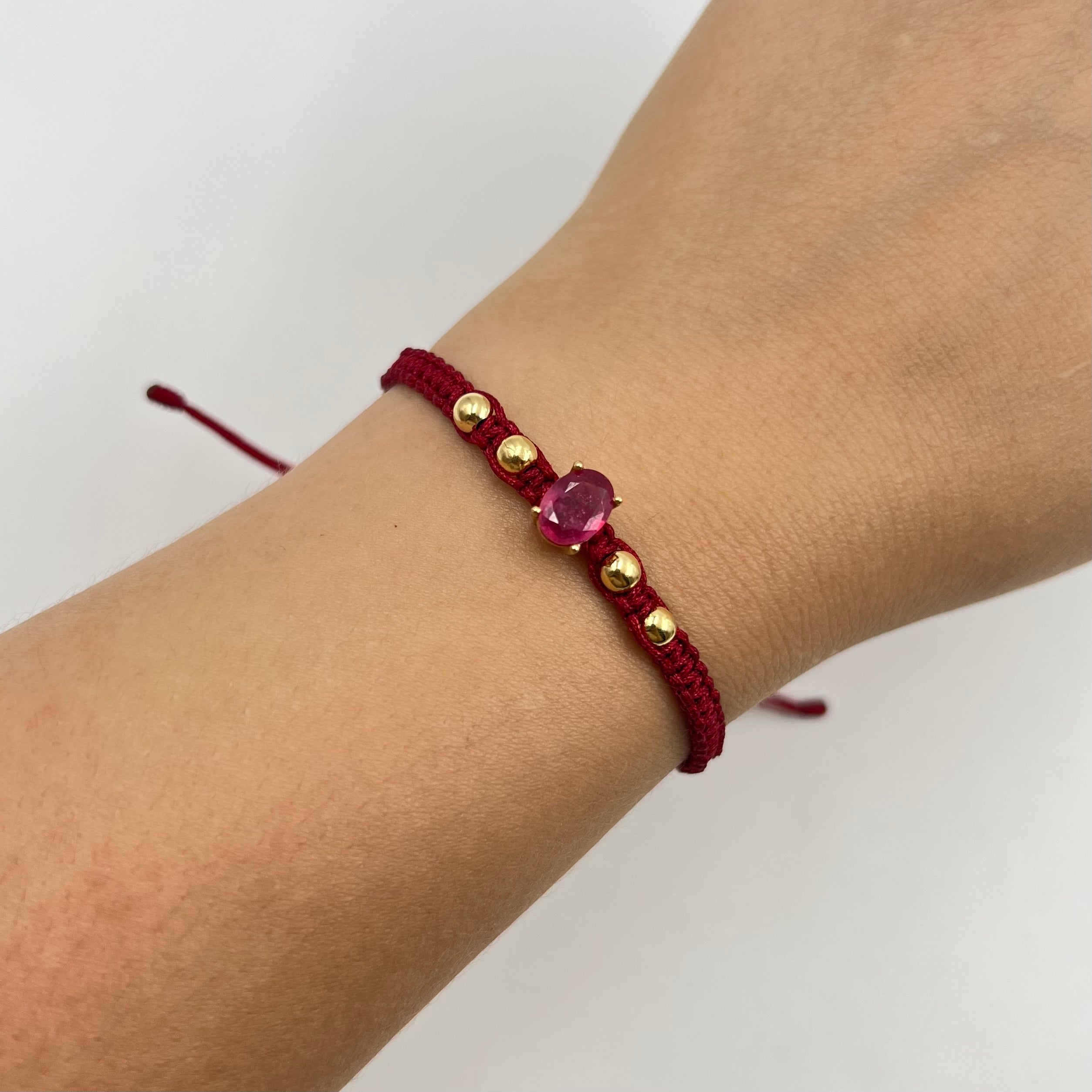 PULSERA TEJIDA VINOTINTO / HERRAJE RUBI 1,5 CT/  BOLA LISA 4MM / 1,07 GR (JOYA)