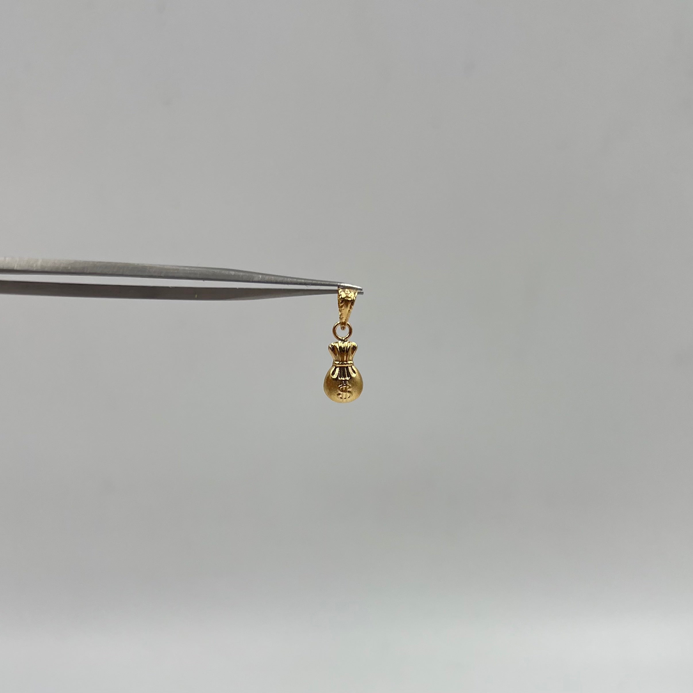 DIJE BOLSA DINERO ORO AMARILLO 18K 0,30 GR / 5,61 MM / 1,1 CM